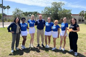 A Photo of 5 students from the The NCF Treeleaders Club, wearing their club uniforms, posing with 3 faculty.