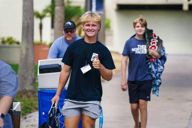 Student gives Thumbs up to camera