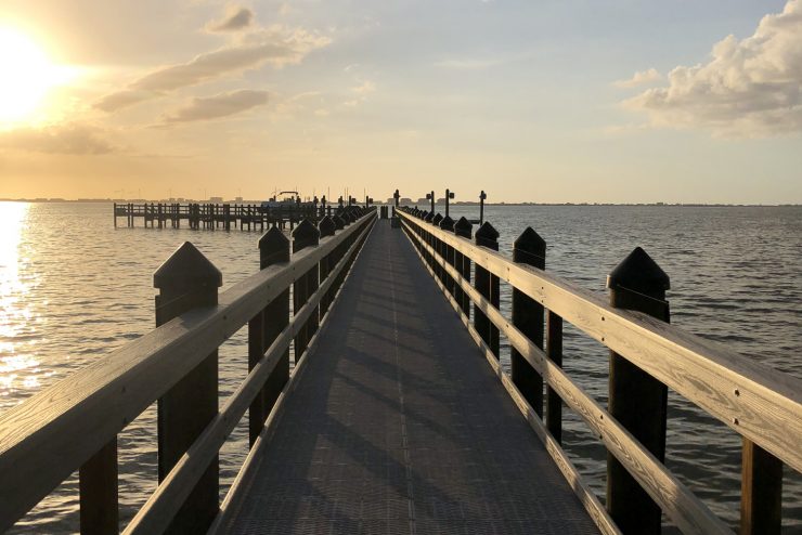 Dock at the waterfront during sunset