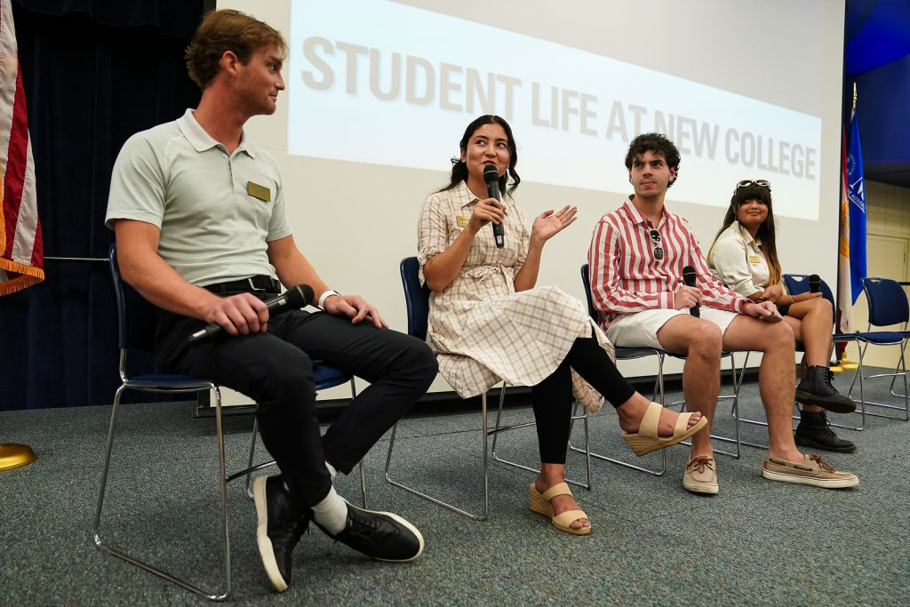 Students speak on stage at new student orientation