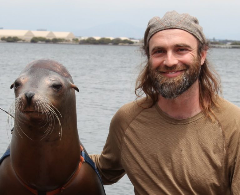 Matt Schalles Headshot with a seal