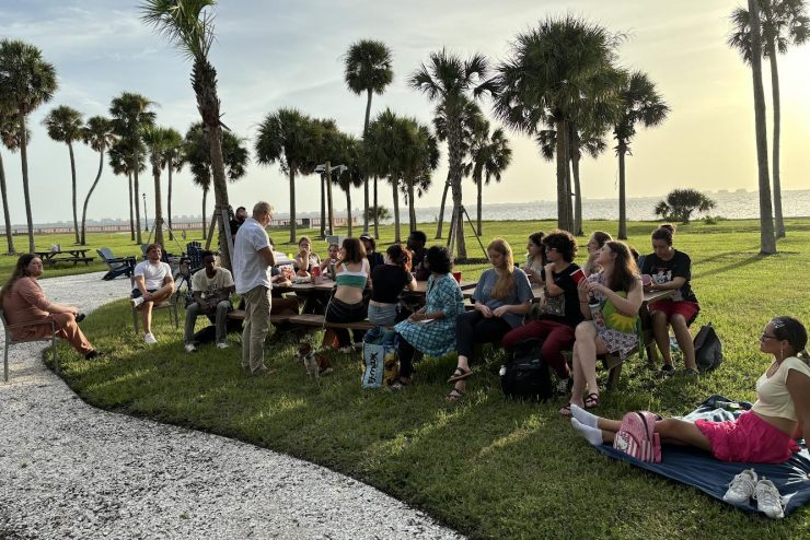 students sitting together near the bayfront